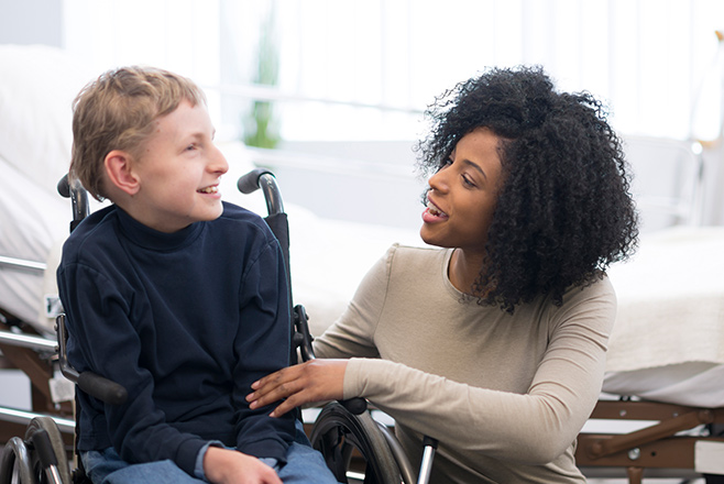A woman and a child in a wheelchair